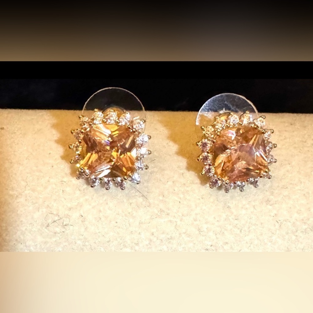 Swarovski crystal stud earrings surrounded by clear crystals post back